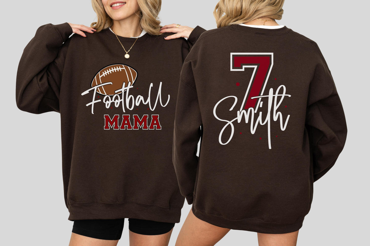 May include: A dark brown crewneck sweatshirt featuring a graphic of a football and the text "Football MAMA" on the front. The back of the sweatshirt displays the large number "7" in maroon with a white outline above the name "Smith" in white script.