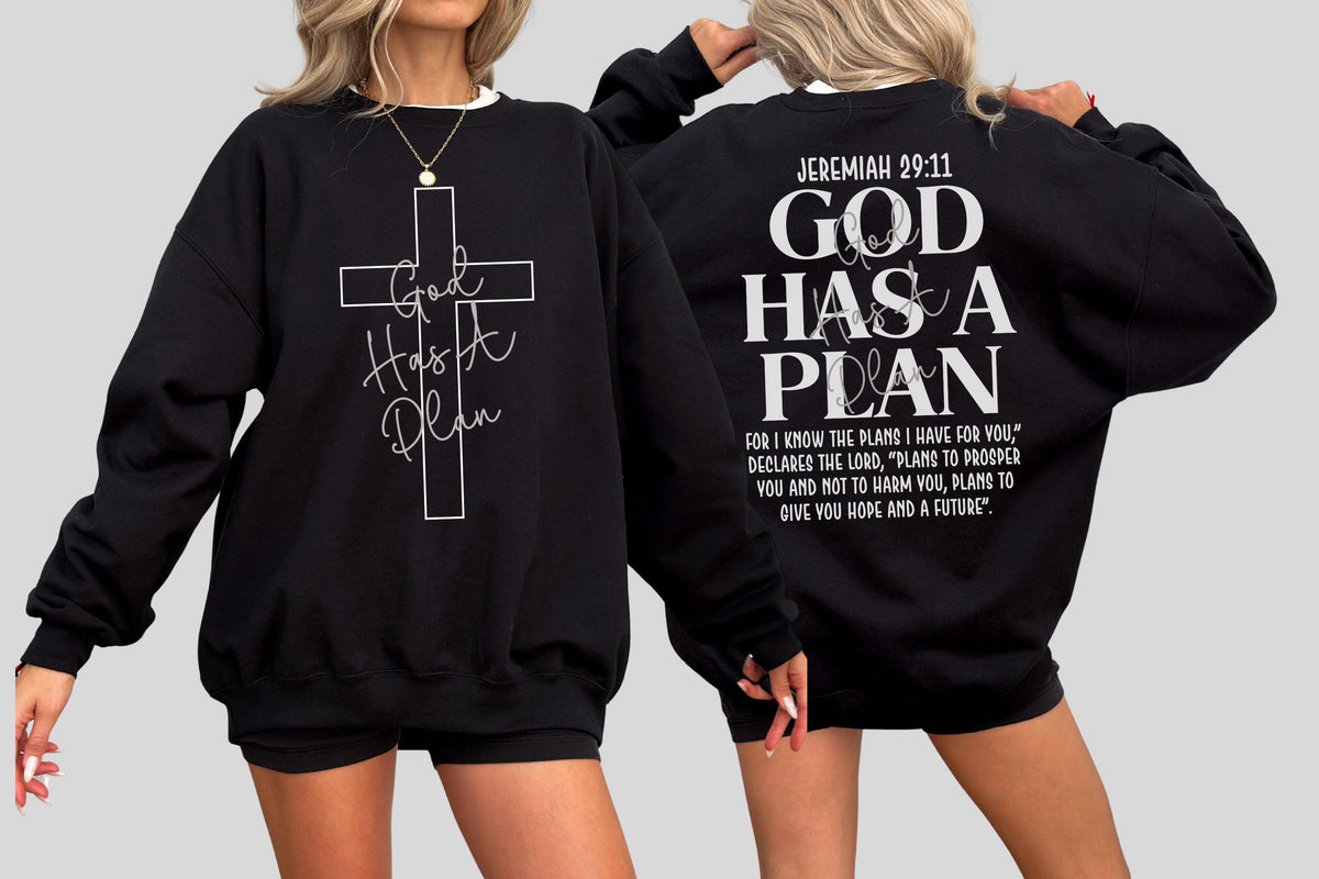 May include: Black sweatshirt with white text and a cross design. The front features a cross with "God Has A Plan" written inside. The back displays "Jeremiah 29:11" and the phrase "God Has A Plan" with a Bible verse.