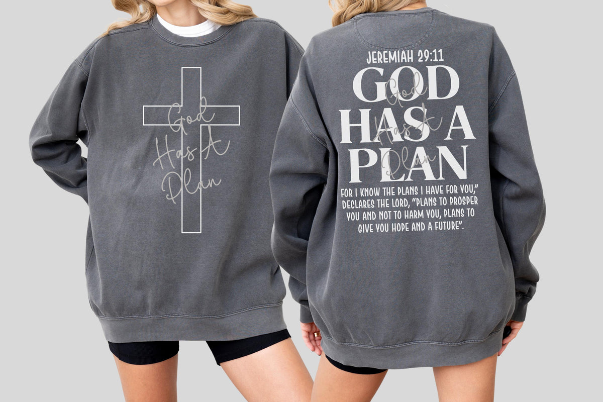 May include: A charcoal gray sweatshirt with the text "God Has A Plan" and a cross design on the front. The back of the sweatshirt features the text "Jeremiah 29:11" and a longer quote about hope and the future.