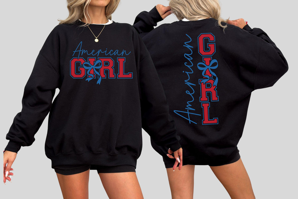 May include: Black sweatshirt with the text "American Girl" in red and blue. The front features the text with a bow graphic, and the back has the same text vertically. The sweatshirt has long sleeves and a crew neck.