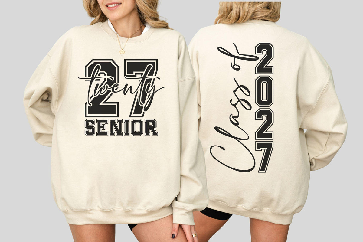 May include: Cream-colored sweatshirt with black text. The front displays "27 Twenty SENIOR" in a bold, collegiate font. The back features "Class of 2027" vertically, with the year in a similar style. A casual, comfortable garment.