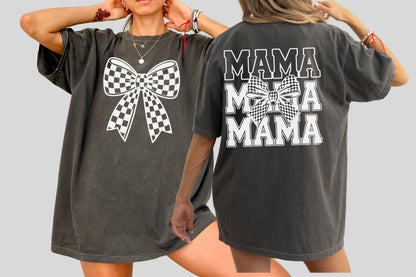 May include: Dark grey t-shirts with a large white checkered bow graphic on the front. The back of the shirt has the word "MAMA" in white block letters, with a checkered bow graphic in the middle.