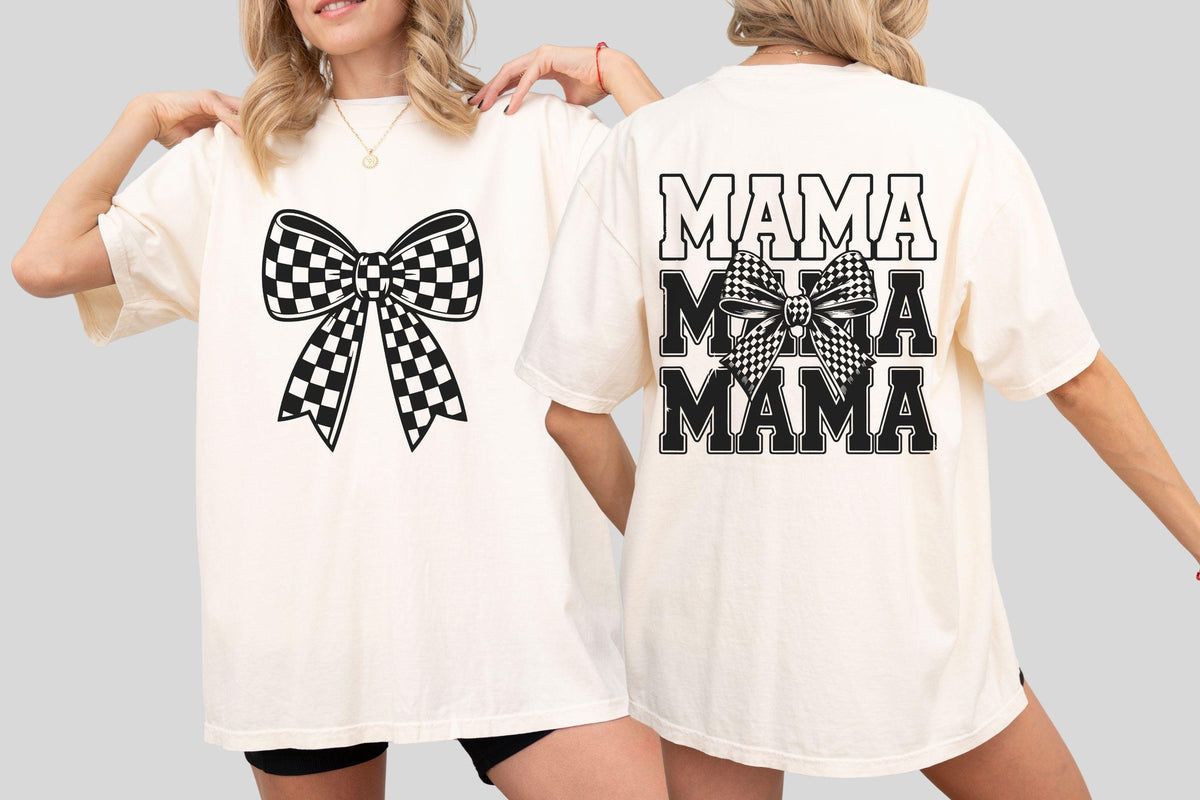 May include: Cream-colored t-shirt featuring a large black and white checkered bow on the front. The back of the shirt displays the word "MAMA" in a stacked design, also in black, with a checkered bow graphic.