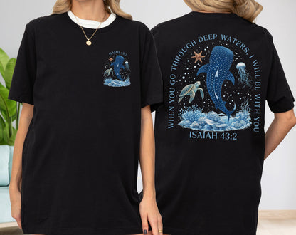 May include: Black t-shirt featuring a marine life design with a whale shark, turtle, and jellyfish. The front has a small graphic, while the back displays a larger design with the text "When you go through deep waters, I will be with you. Isaiah 43:2."
