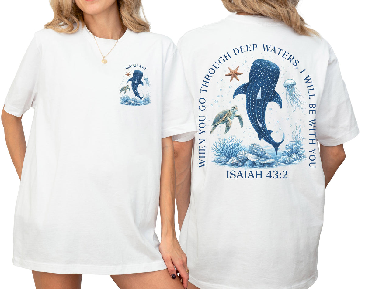 May include: White t-shirt with a marine life design. The front features a whale shark, turtle, and text "Isaiah 43:2". The back has a larger design with the text "When you go through deep waters, I will be with you".