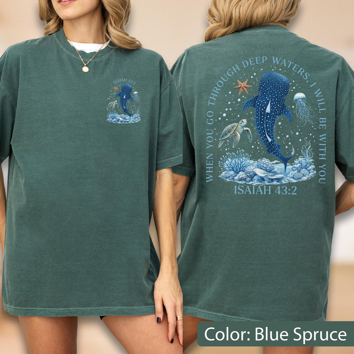 May include: Blue spruce t-shirt featuring a whale shark design with the text "WHEN YOU GO THROUGH DEEP WATERS, I WILL BE WITH YOU" and "ISAIAH 43:2". The front of the shirt has a smaller matching design.