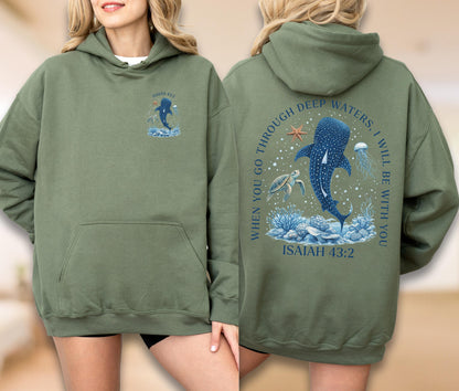May include: Olive green hoodie with a front pocket and a hood. The front features a small graphic of a whale shark and the text "ISAIAH 43:2". The back displays a larger graphic of a whale shark, turtle, and jellyfish with the text "WHEN YOU GO THROUGH DEEP WATERS, I WILL BE WITH YOU" and "ISAIAH 43:2".
