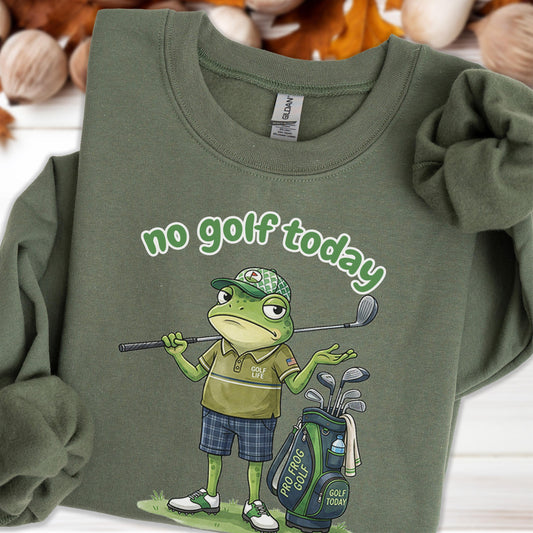 May include: Olive green sweatshirt with the text "no golf today" in a whimsical font. The graphic features a grumpy frog in a golf outfit, holding a golf club, with a golf bag nearby. The frog is wearing a hat and plaid shorts.