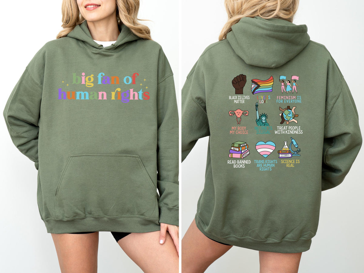 May include: An olive green hoodie with the text "big fan of human rights" in colorful letters on the front. The back of the hoodie features various graphic icons and phrases, including "Black Lives Matter" and "Treat People With Kindness."