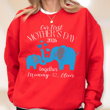 May include: A red sweatshirt with the text "Our First Mother's Day 2026" and a blue elephant design. The design includes two elephants, hearts, and the names "Mommy" and "Oliver".