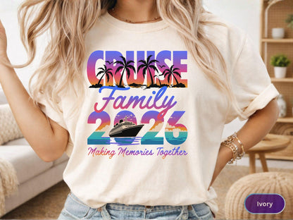 May include: Ivory-colored t-shirt with a colorful cruise-themed graphic. The design includes the words "CRUISE FAMILY 2026" with palm trees, a cruise ship, and the phrase "Making Memories Together."
