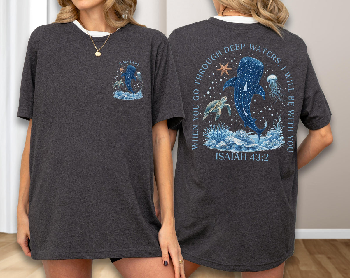 May include: Dark gray t-shirt with a white collar featuring a marine-themed graphic. The front has a whale shark design with text. The back displays a larger whale shark, turtle, and jellyfish design with the text "WHEN YOU GO THROUGH DEEP WATERS, I WILL BE WITH YOU" and "ISAIAH 43:2".