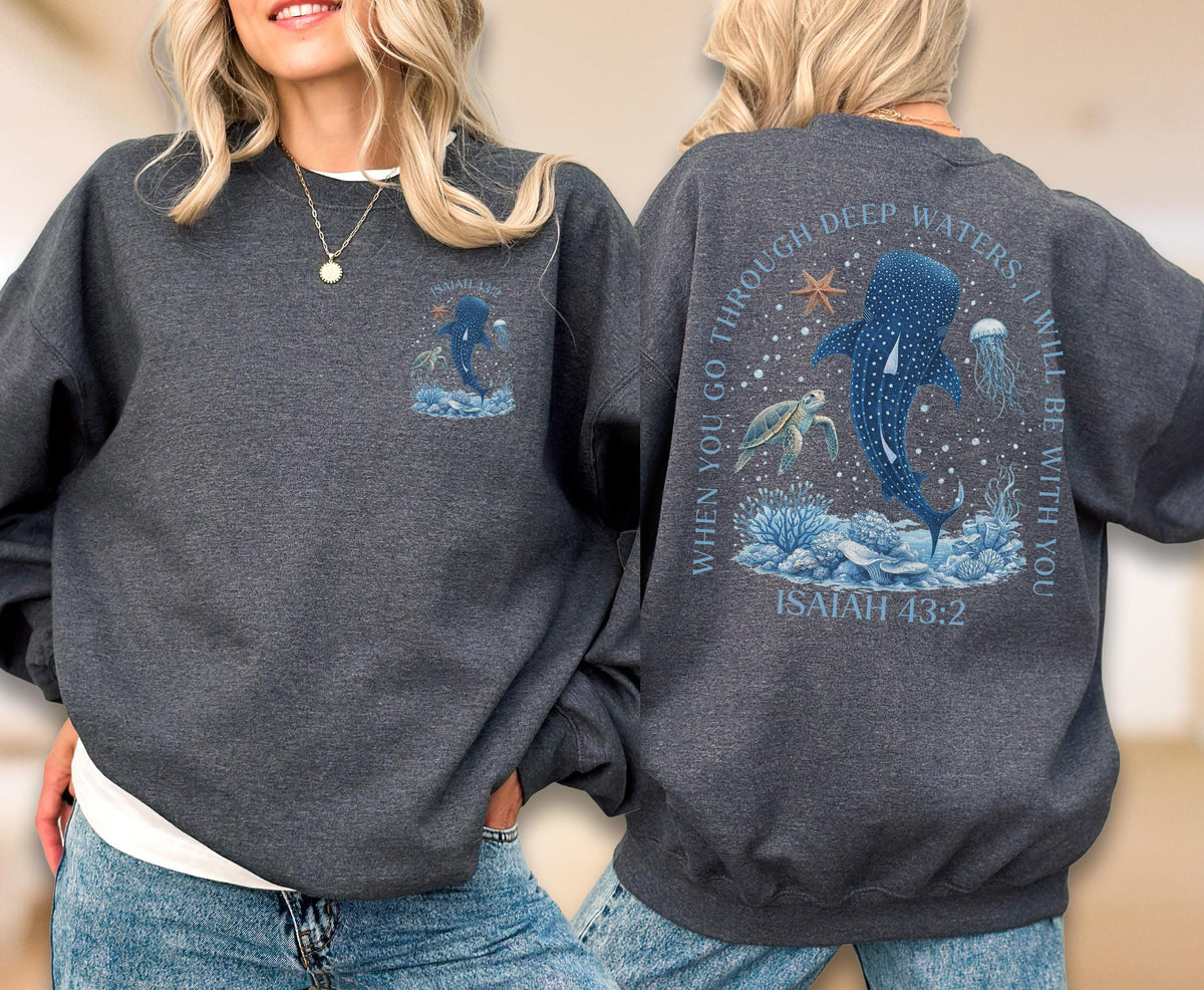 May include: Dark gray sweatshirt with a marine-themed design. The front features a whale shark illustration. The back displays a whale shark, turtle, and jellyfish with the text "When you go through deep waters, I will be with you. Isaiah 43:2."