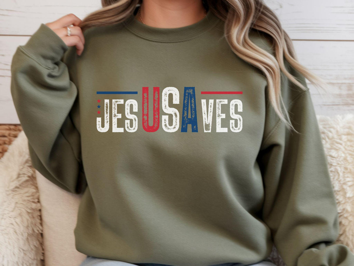 May include: Olive green sweatshirt with the text "JESUS SAVES" in white, with the letters "USA" in red and blue, and a patriotic design. The sweatshirt has a crew neck and long sleeves.