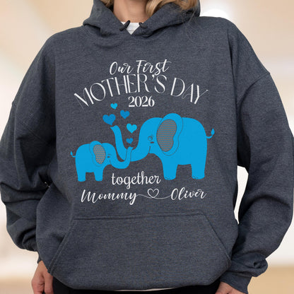 May include: Dark gray hoodie with a blue elephant graphic and the text "Our First Mother's Day 2026" above two blue elephants. Below the elephants is the text "together Mommy Oliver".