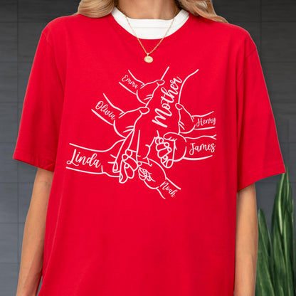 May include: Red t-shirt with a white graphic of hands holding each other, with the word "Mother" in the center. Names like "Emma", "Olivia", "Linda", "Noah", "James", and "Henry" are also visible.
