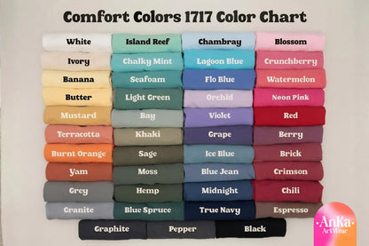 May include: A color chart titled "Comfort Colors 1717 Color Chart" displays a variety of fabric colors, including white, ivory, and black. Each color is labeled with its name, such as "Blossom" and "Chambray."