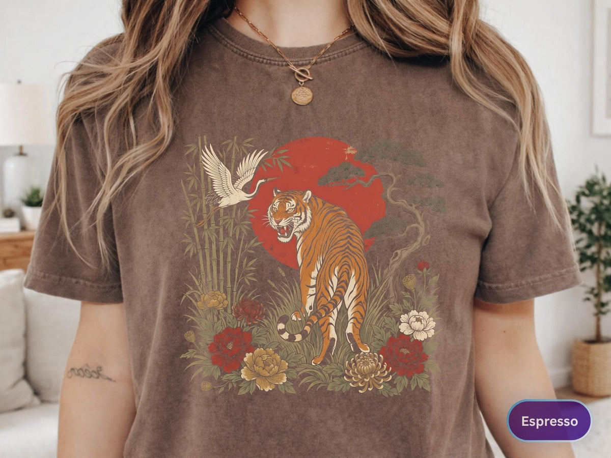 May include: Espresso-colored t-shirt featuring a tiger illustration. The design includes a red sun, crane, bamboo, and flowers. The tiger is orange and black, with the word "Espresso" in a purple oval.