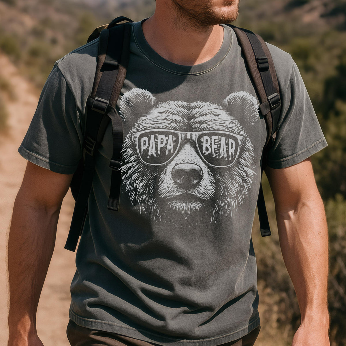 May include: A dark gray t-shirt with a graphic of a bear wearing sunglasses. The sunglasses have the words "Papa Bear" written on them.