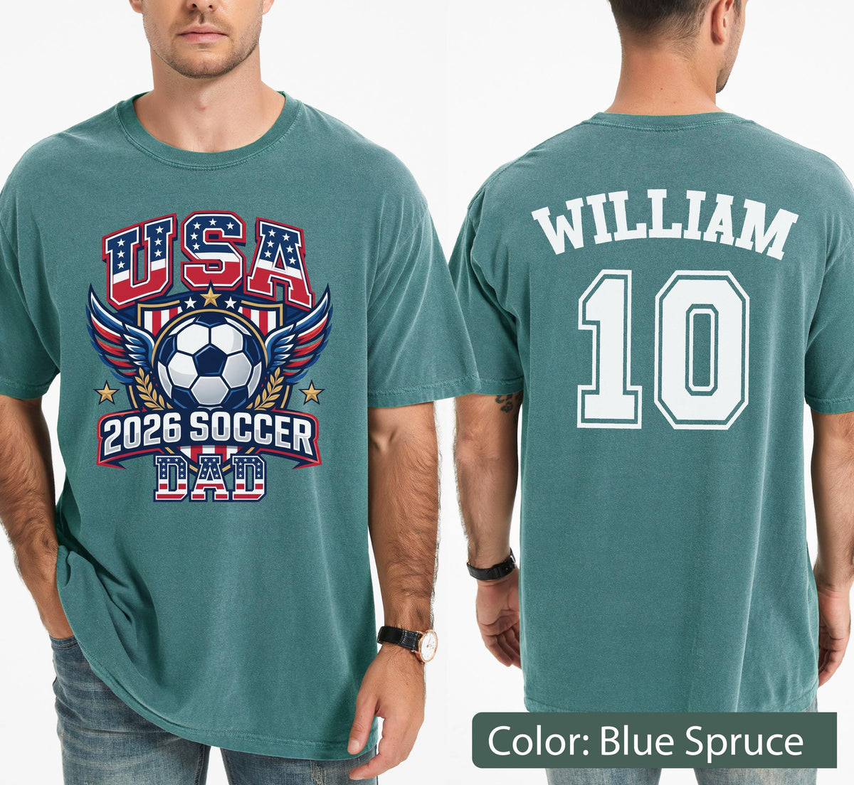 May include: Blue spruce t-shirt with a soccer-themed graphic. The front features "USA" in red, white, and blue, a soccer ball, wings, and "2026 SOCCER DAD." The back displays "WILLIAM" and the number "10" in white.