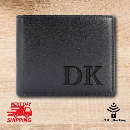 May include: Black leather wallet with the initials "DK" embossed on the front. The wallet is rectangular and appears to be new. The image also includes a "Next Day Shipping" graphic and an "RFID Blocking" icon.