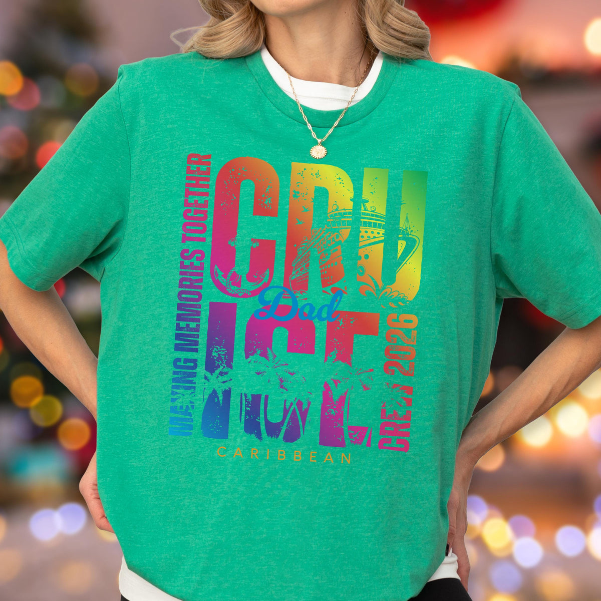 May include: A green t-shirt with a colorful graphic that reads "CRU Dad ICE CREW 2026 Caribbean". The text is in a rainbow gradient, with a cruise ship and palm trees. The words "Making Memories Together" are printed vertically on the left side.