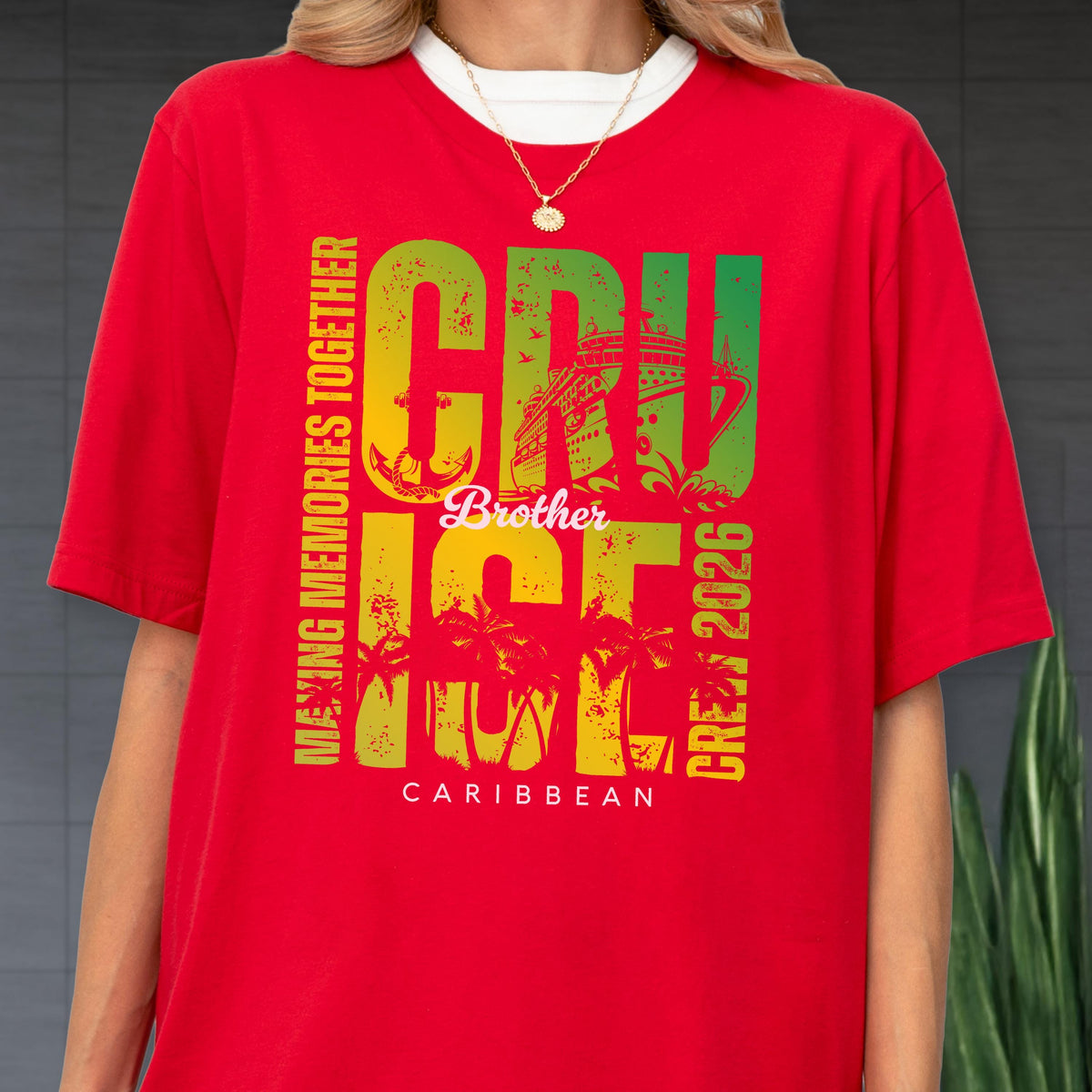 May include: Red t-shirt with a white collar featuring a colorful graphic. The graphic includes the word "CRUISE" in green and yellow, a cruise ship illustration, and the text "MAKING MEMORIES TOGETHER" and "CREW 2026". The word "Brother" is also included.
