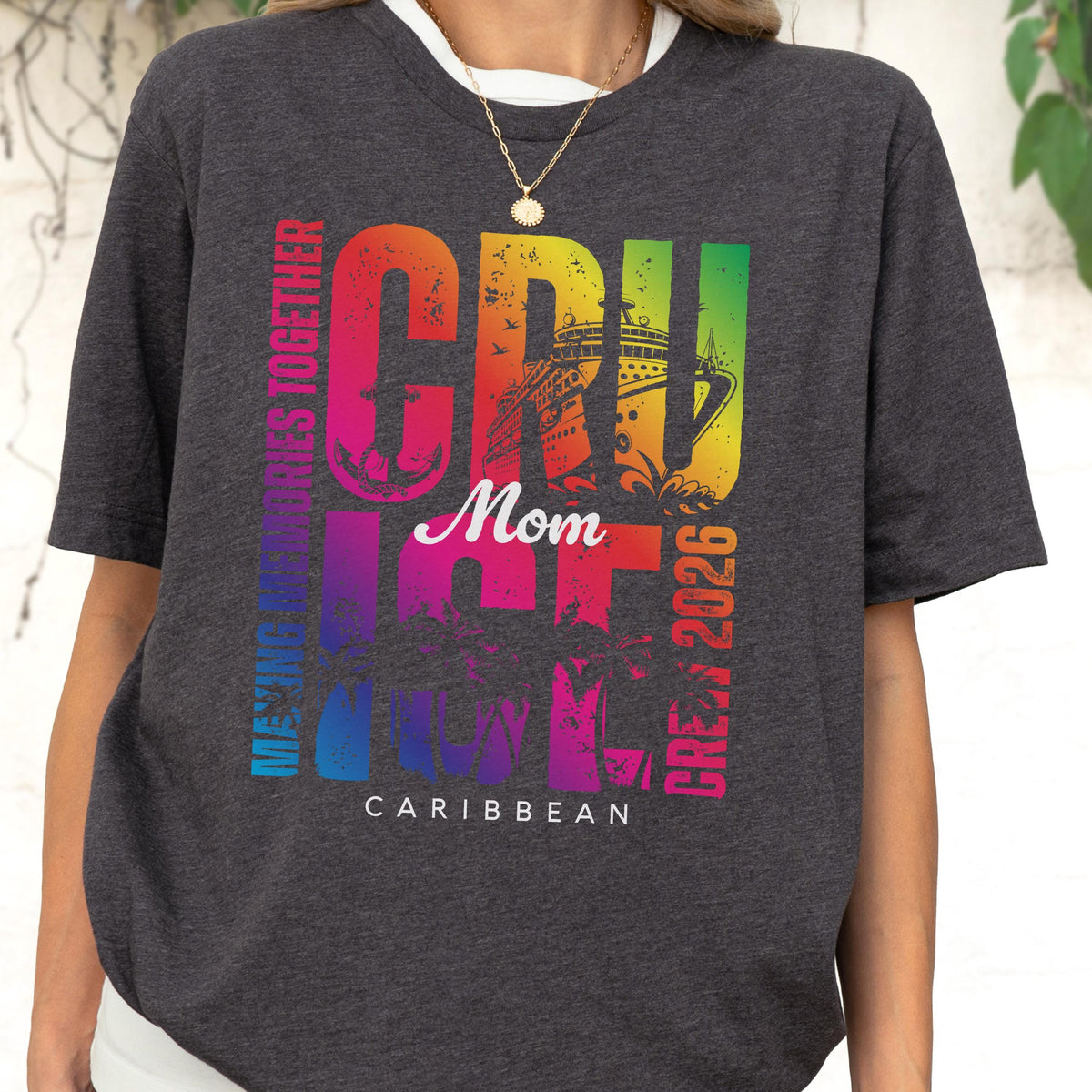 May include: Dark gray t-shirt with a colorful graphic that says "CRUISE Mom 2026 Caribbean". The design includes a cruise ship and the words "Making Memories Together" in vertical text.