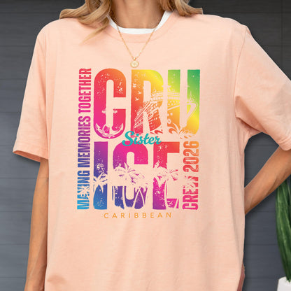 May include: A peach-colored t-shirt with a white collar features a colorful graphic that reads "CRUISE" with a cruise ship illustration, "Sister", "ICE", "CREW 2026", and "CARIBBEAN". The words "MAKING MEMORIES TOGETHER" are printed vertically.