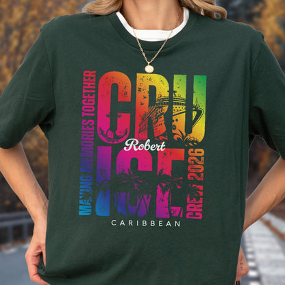 May include: Dark green t-shirt with a colorful cruise ship graphic. The design includes the word "CRUISE" in rainbow colors, the name "Robert", and the text "Caribbean Crew 2026". The shirt also features palm trees and the phrase "Making Memories Together".