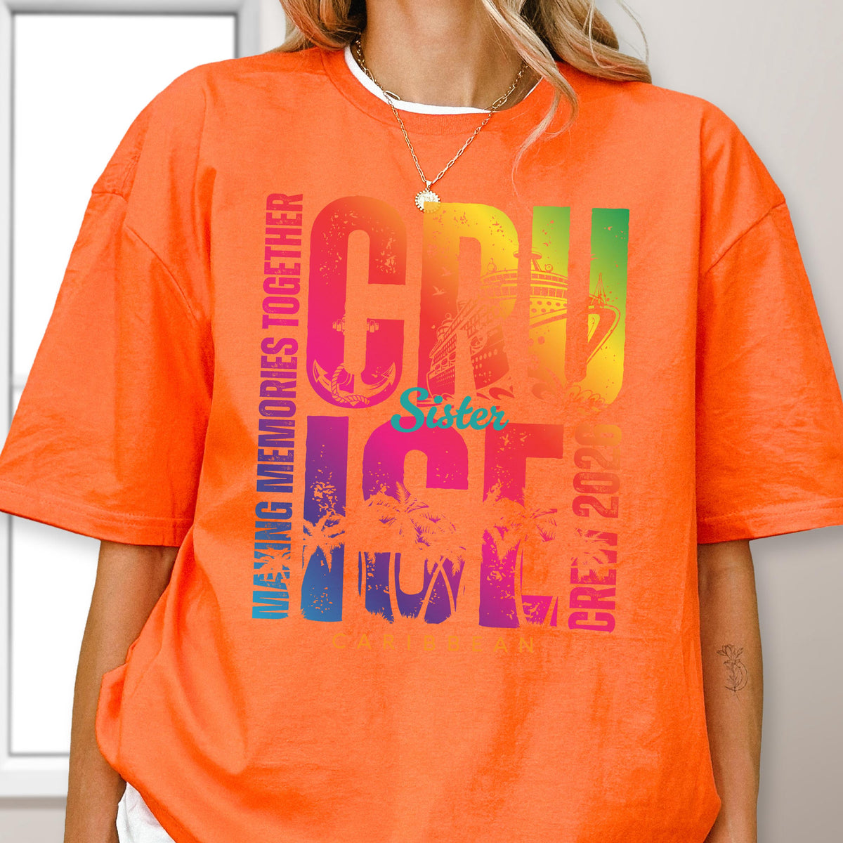 May include: Bright orange t-shirt with a colorful graphic that says "CRUISE" in large letters, with "Sister" in the middle. The shirt also has the words "MAKING MEMORIES TOGETHER" and "CREW 2020". The graphic includes a cruise ship and palm trees.