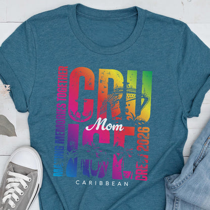May include: Teal t-shirt with a colorful graphic that says "CRUISE Mom CARIBBEAN 2026". The word "CRUISE" is in large, rainbow-colored letters, with a cruise ship illustration. The text "MAKING MEMORIES TOGETHER" is printed vertically on the left side.
