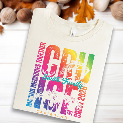 May include: Cream-colored t-shirt with a colorful graphic that says "CRUISE" in large letters. The design includes a cruise ship, palm trees, and the words "MAKING MEMORIES TOGETHER", "Smith Family", "CREW 2026", and "CARIBBEAN".