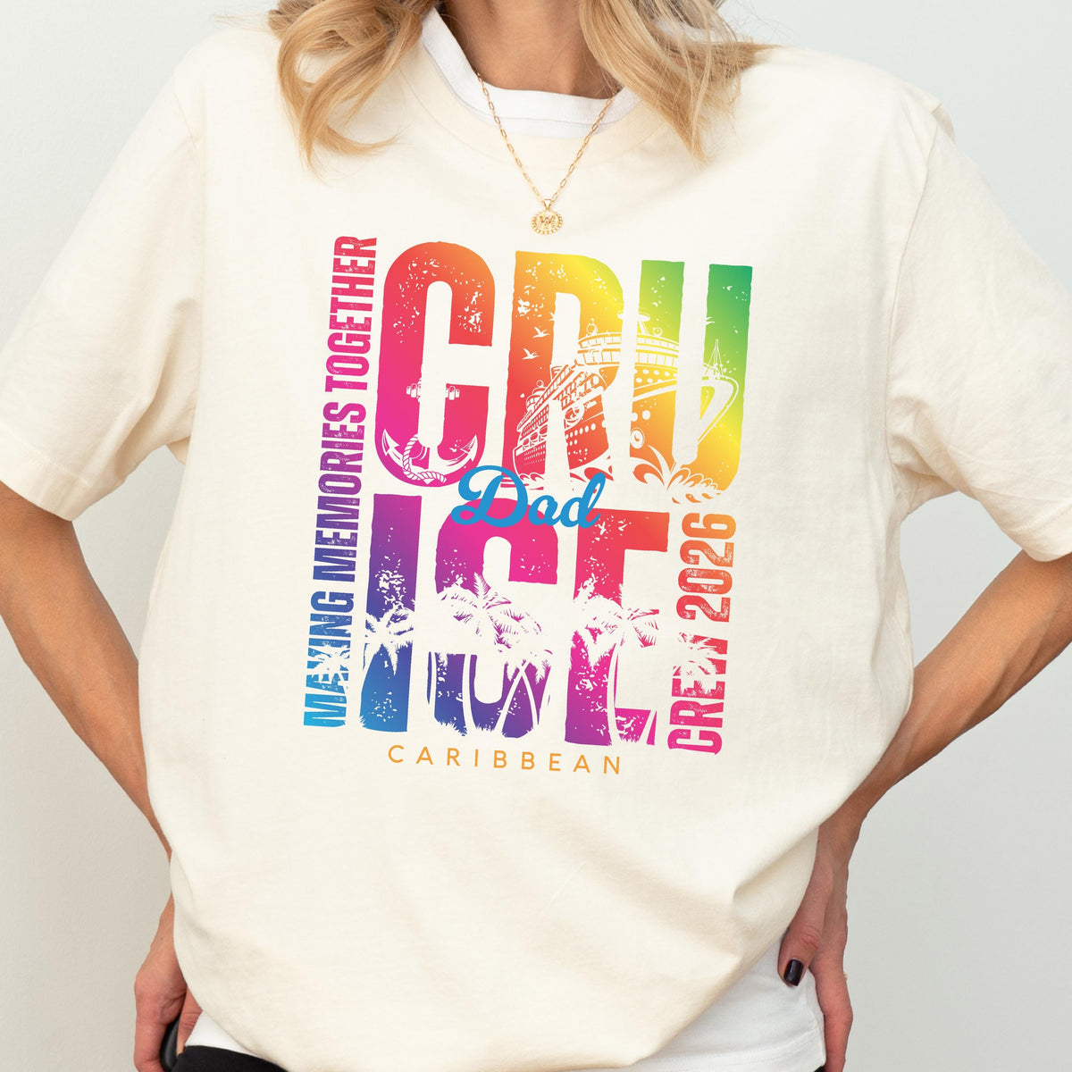 May include: Cream-colored t-shirt with a colorful graphic that says "CRUISE Dad ICE CREW 2026 Caribbean". The design includes a cruise ship, palm trees, and the words "MAKING MEMORIES TOGETHER".