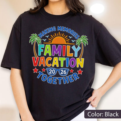 May include: A black t-shirt featuring a colorful graphic with the text "MAKING MEMORIES FAMILY VACATION TOGETHER" and "20 26". The design includes a bright orange sun, green palm trees, and blue sunglasses, accented by small red stars.