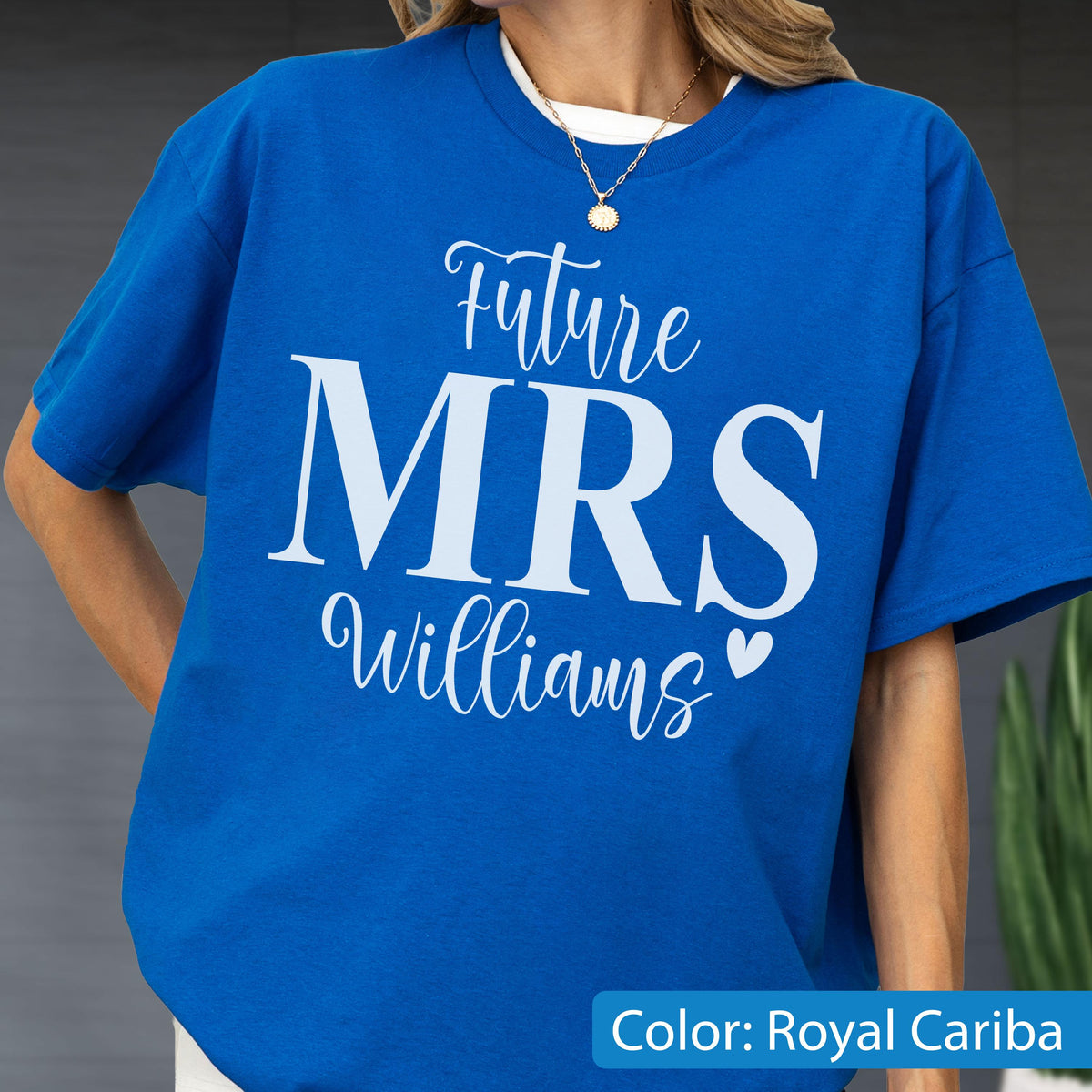 May include: A royal blue short-sleeved t-shirt featuring white text that reads Future MRS Williams with a small heart icon. The design is centered on the chest area of the garment. The shirt has a crew neckline and a relaxed fit construction.