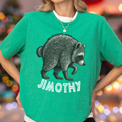 May include: A bright green short-sleeved t-shirt featuring a detailed graphic of a raccoon with intricate leaf-like patterns in its fur. Below the raccoon, the text JIMOTHY is printed in bold, white, sans-serif capital letters on the chest.