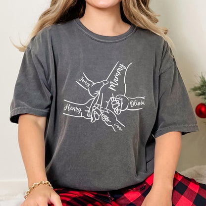 May include: A gray t-shirt with a white graphic of five hands holding each other. The hands are labeled "Mommy", "James", "Henry", "Olivia", and "Emma".