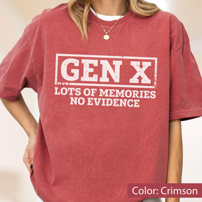 May include: A crimson short-sleeved t-shirt featuring a white rectangular graphic with the text "GEN X" in large block letters, followed by the text "LOTS OF MEMORIES NO EVIDENCE" in smaller white lettering centered below the box.