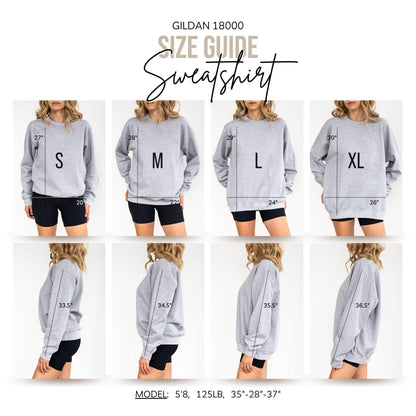 May include: A Gildan 18000 sweatshirt size guide featuring eight images of a grey crewneck sweatshirt in sizes S, M, L, and XL. Front and side views show measurements in inches, including lengths from 27 to 30 inches and sleeve lengths from 33.5 to 36.5 inches.