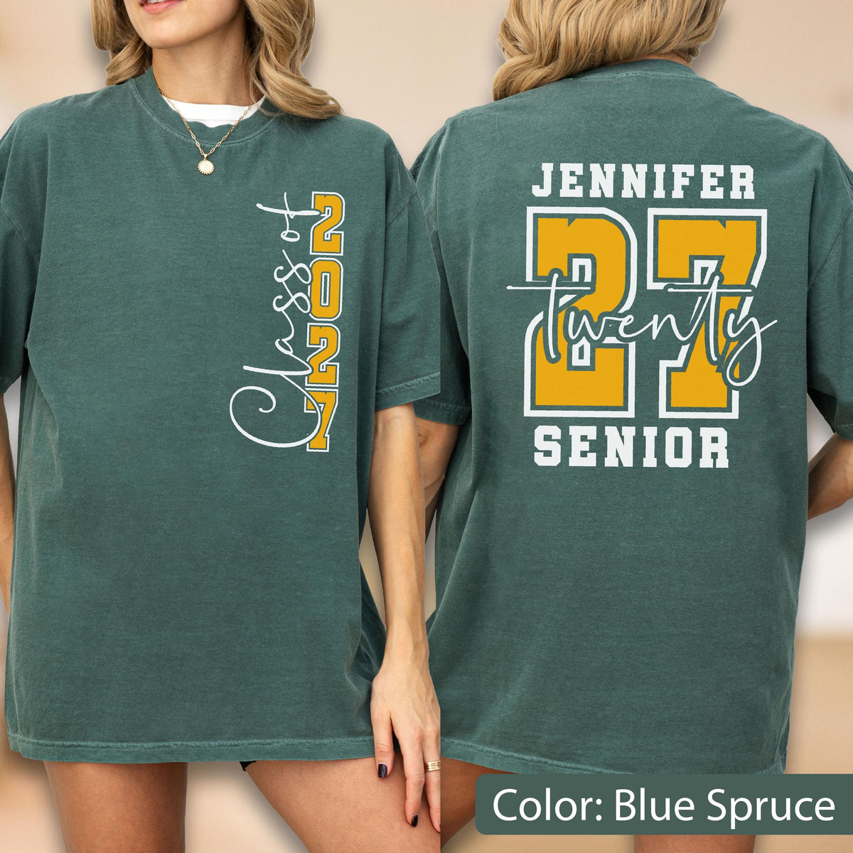 May include: A blue spruce t-shirt featuring a vertical white and yellow graphic on the front that reads Class of 2027. The back displays the name Jennifer, the large yellow number 27, the word twenty in white script, and the word SENIOR.