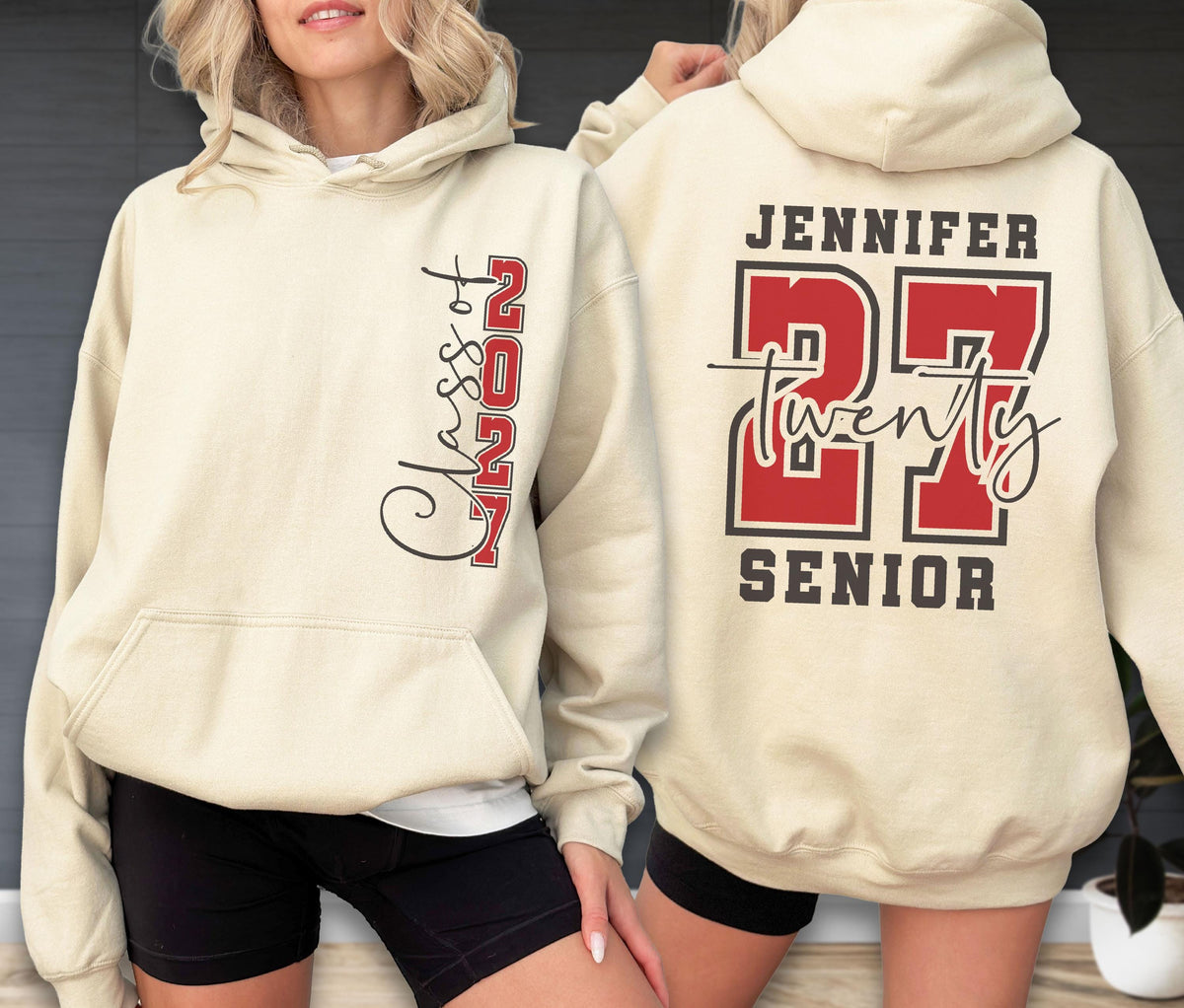 May include: A cream-colored hooded sweatshirt featuring a front graphic with the text Class of 2027 in black and red. The back displays the name Jennifer above the large red number 27, the word twenty in script, and the word Senior in black.