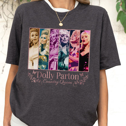 May include: A dark charcoal gray short-sleeve t-shirt featuring a graphic print of six vertical panels displaying various portraits of Dolly Parton. Below the images, the text reads Dolly Parton Country Queen, accented by small butterfly and floral illustrations.