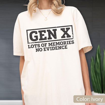 May include: An ivory short-sleeve t-shirt featuring a black rectangular graphic with the text "GEN X" in a bold, distressed font. Below the rectangle, the text "LOTS OF MEMORIES NO EVIDENCE" is printed in a matching black, distressed, sans-serif font.