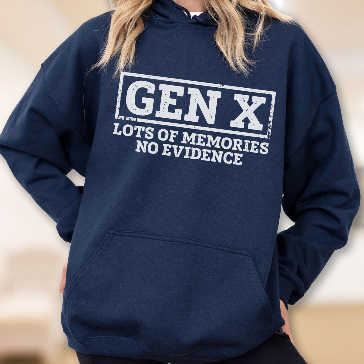 May include: A navy blue hooded sweatshirt featuring a white graphic print on the chest. The text reads "GEN X" inside a rectangular border, with the words "LOTS OF MEMORIES NO EVIDENCE" printed directly underneath in a distressed, block-style font.