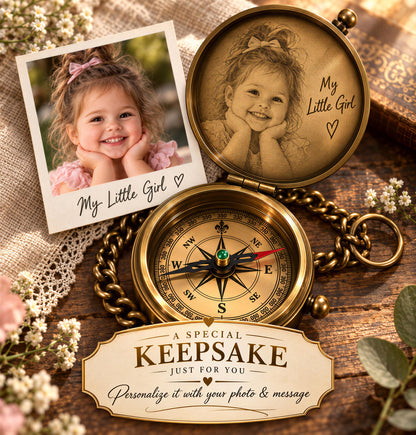 a personalized keepsake, including a photo of a young girl and a compass with a personalized message.