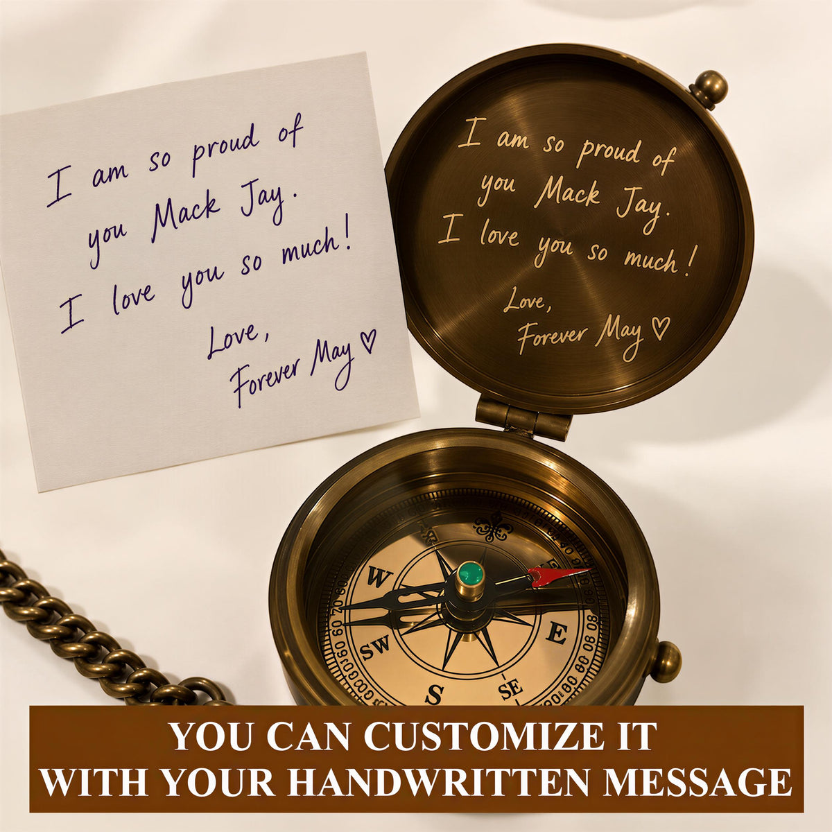 a compass with a handwritten note attached to it, and a chain is visible in the background.