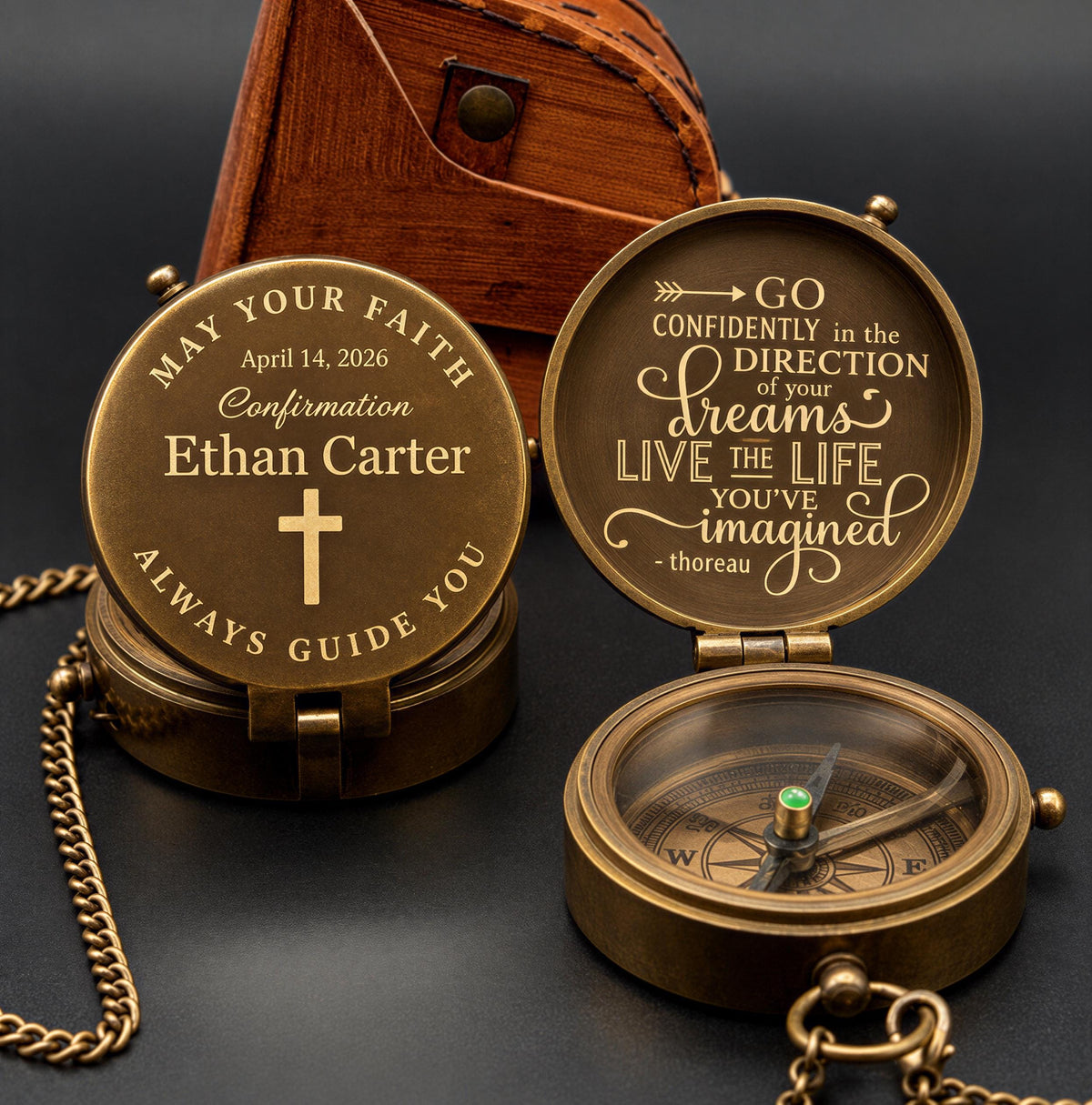 a personalized compass with a message engraved on it, placed on a dark surface next to a wooden box.