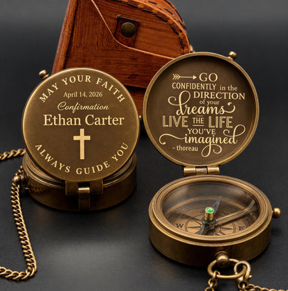 a personalized compass with a message engraved on it, placed on a dark surface next to a wooden box.