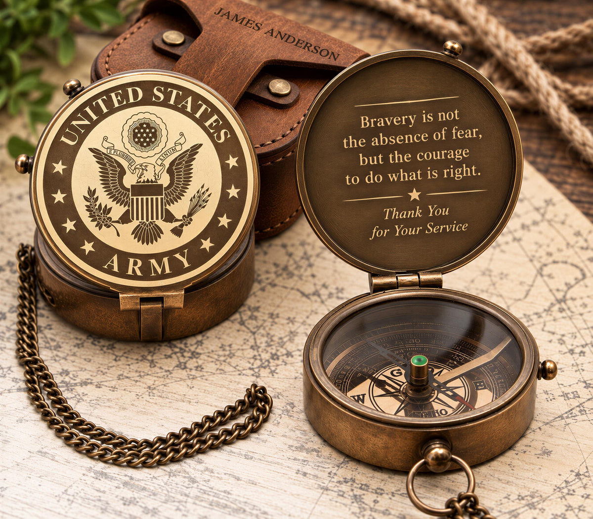 a United States Army compass with a leather case and a chain, placed on a map. The compass has a compass needle pointing to the right, and the case has a United States Army insignia on it.